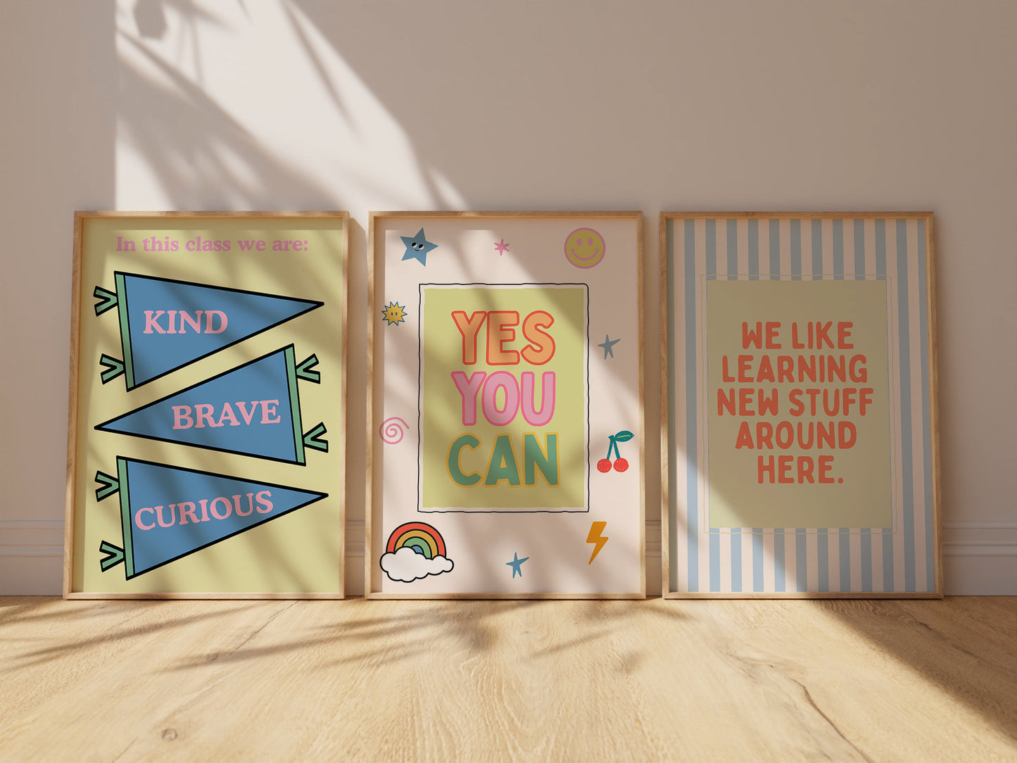 Set of 10 pastel classroom prints in a retro style, including blue pennant flags reading kind, brave, curious, a daily feelings check-in chart with smiling star, cloud, and sun characters, a puzzle piece print reading "There's a place for everyone," and colourful typography posters with quotes like "Wrong answers welcome," "Yes you can," and "It's a good day to try again."