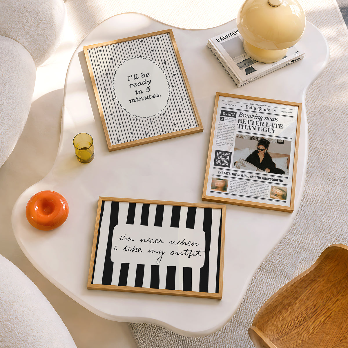 Set of 3 prints: a vintage-style "Daily Quote" newspaper front page reading "Breaking News: Better Late Than Ugly" with a fashion editorial photo of a woman in sunglasses reading a newspaper in bed, a scalloped oval print reading "I'll be ready in 5 minutes." in thin script surrounded by hand-drawn bows, and a black and white striped print with the handwritten quote "I'm nicer when I like my outfit."