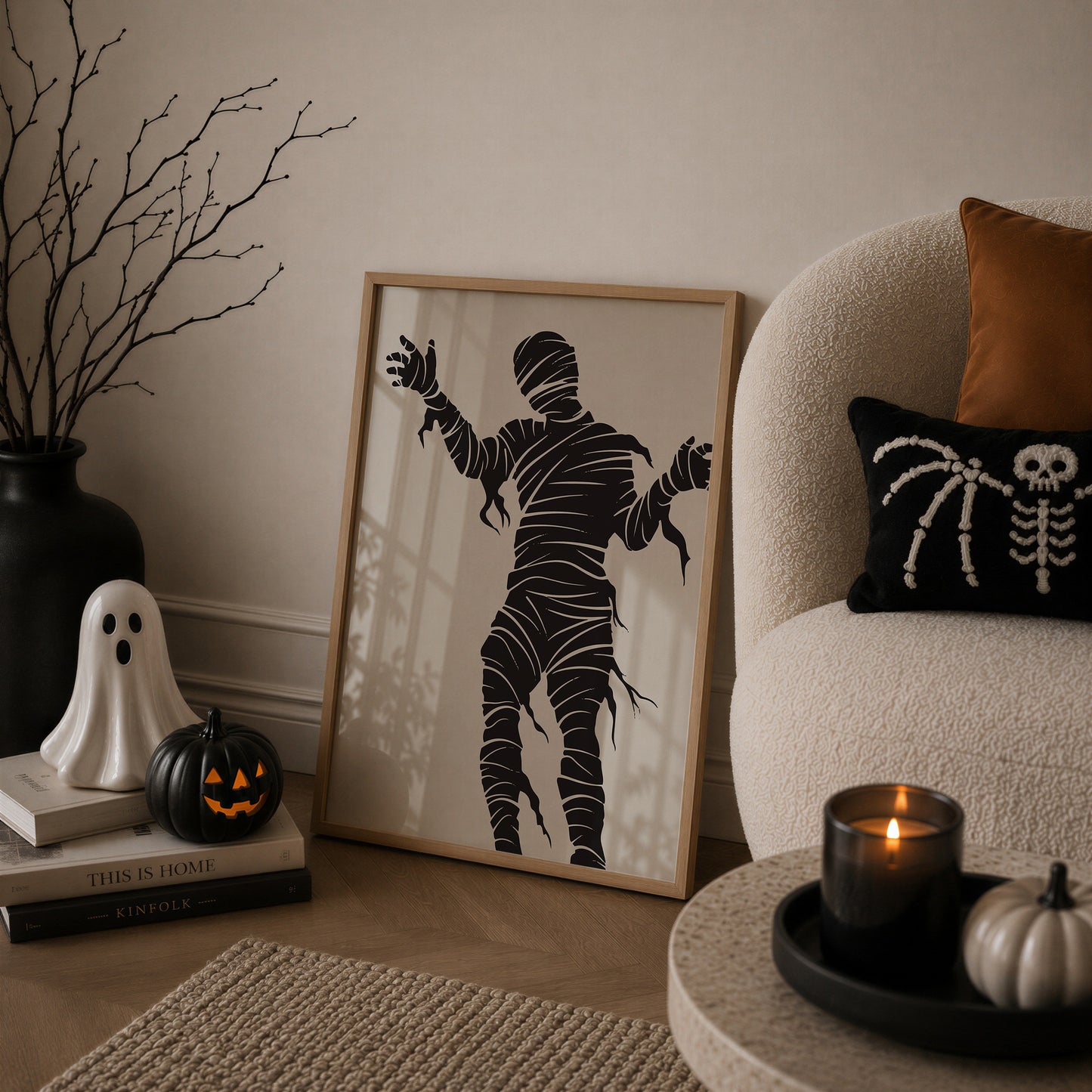 Set of 3 Halloween prints: "Trick or Treat" in dripping black lettering, "Spooky Season" on orange striped fabric with a spider and skeleton, and a bold black silhouette of a mummy.