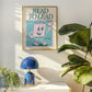 Vertical wall print with bold teal serif typography reading READ TO LEAD above a cheerful retro pink walking book character waving a flag on a teal background