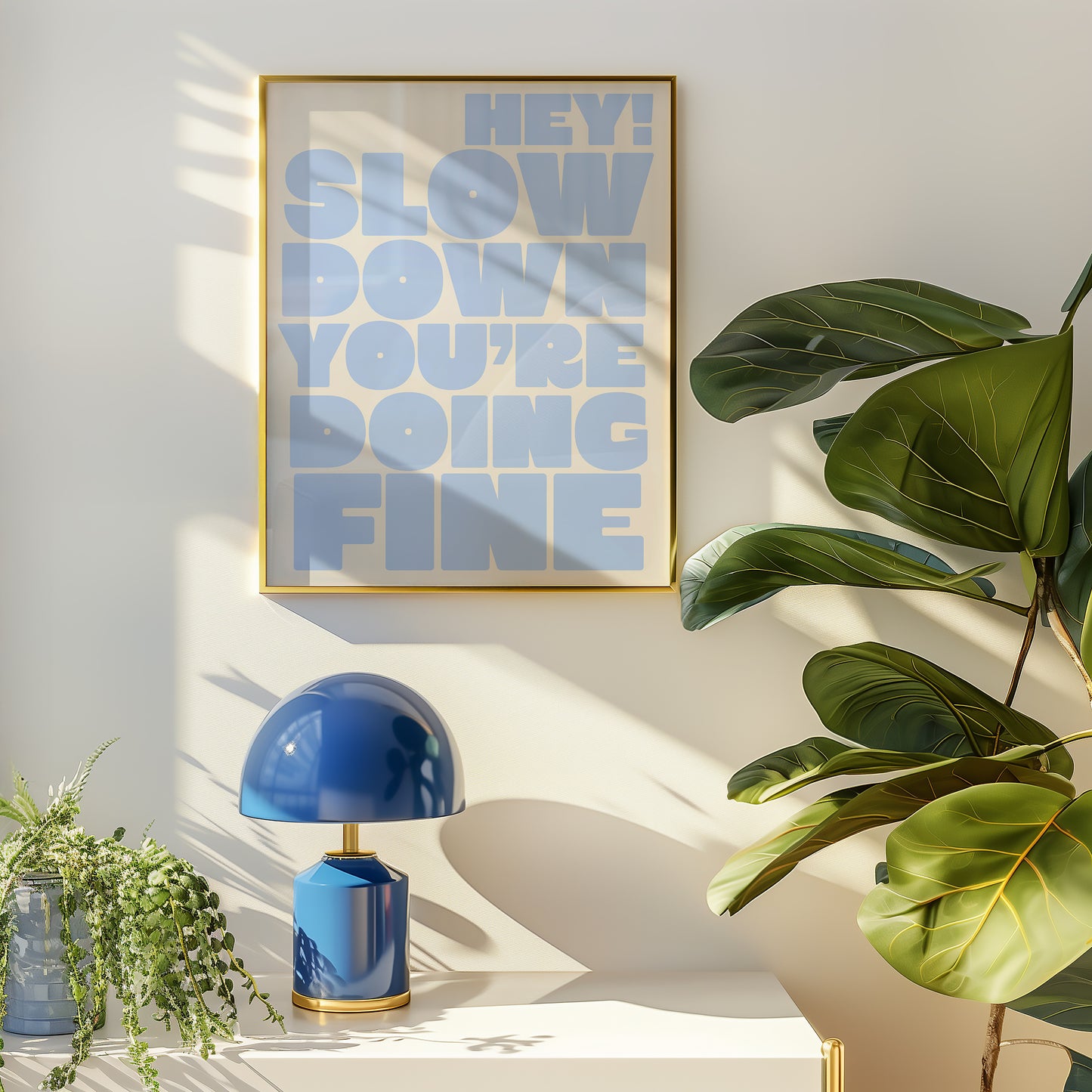 Square wall print on a warm cream background with bold periwinkle blue chunky mixed typography reading Hey! Slow down You're Fine You got this