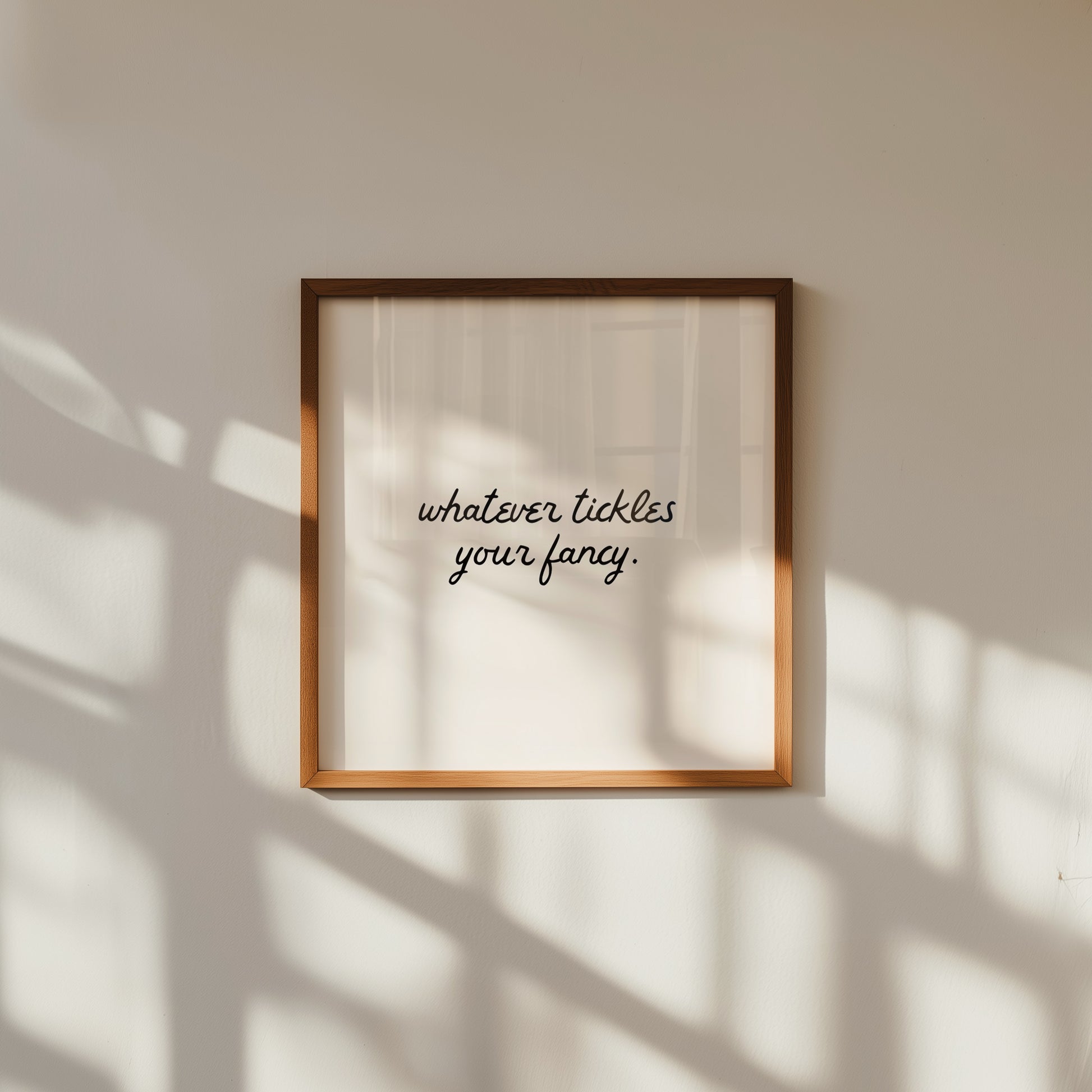 Neutral cream print featuring the handwritten script quote "whatever tickles your fancy."
