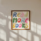 Square print with the words "Read More Books" in large multicolored bubble letters — blue, yellow, pink, green, red, and orange — stacked on three lines against a cream background.