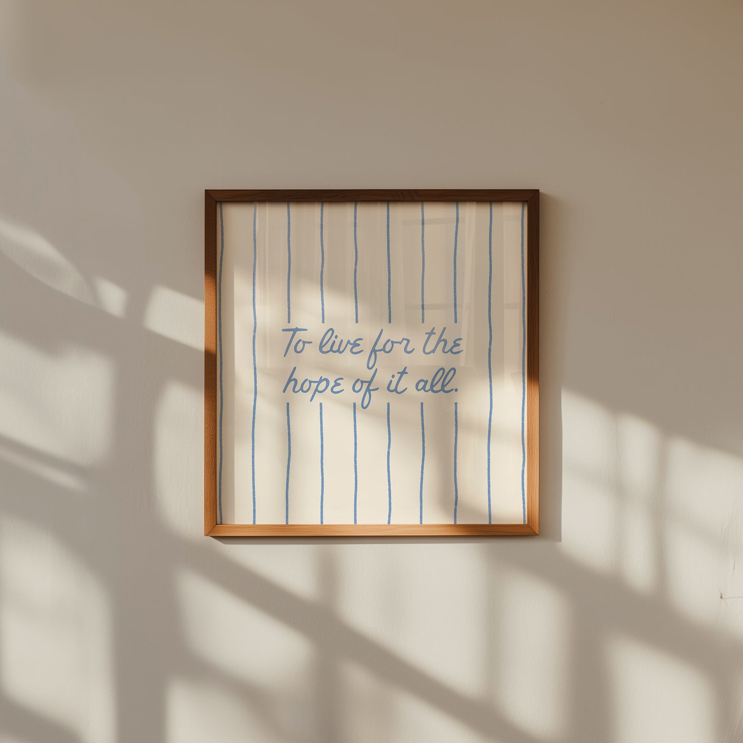 Cream print with thin vertical blue stripes and a hand-lettered quote in blue cursive script