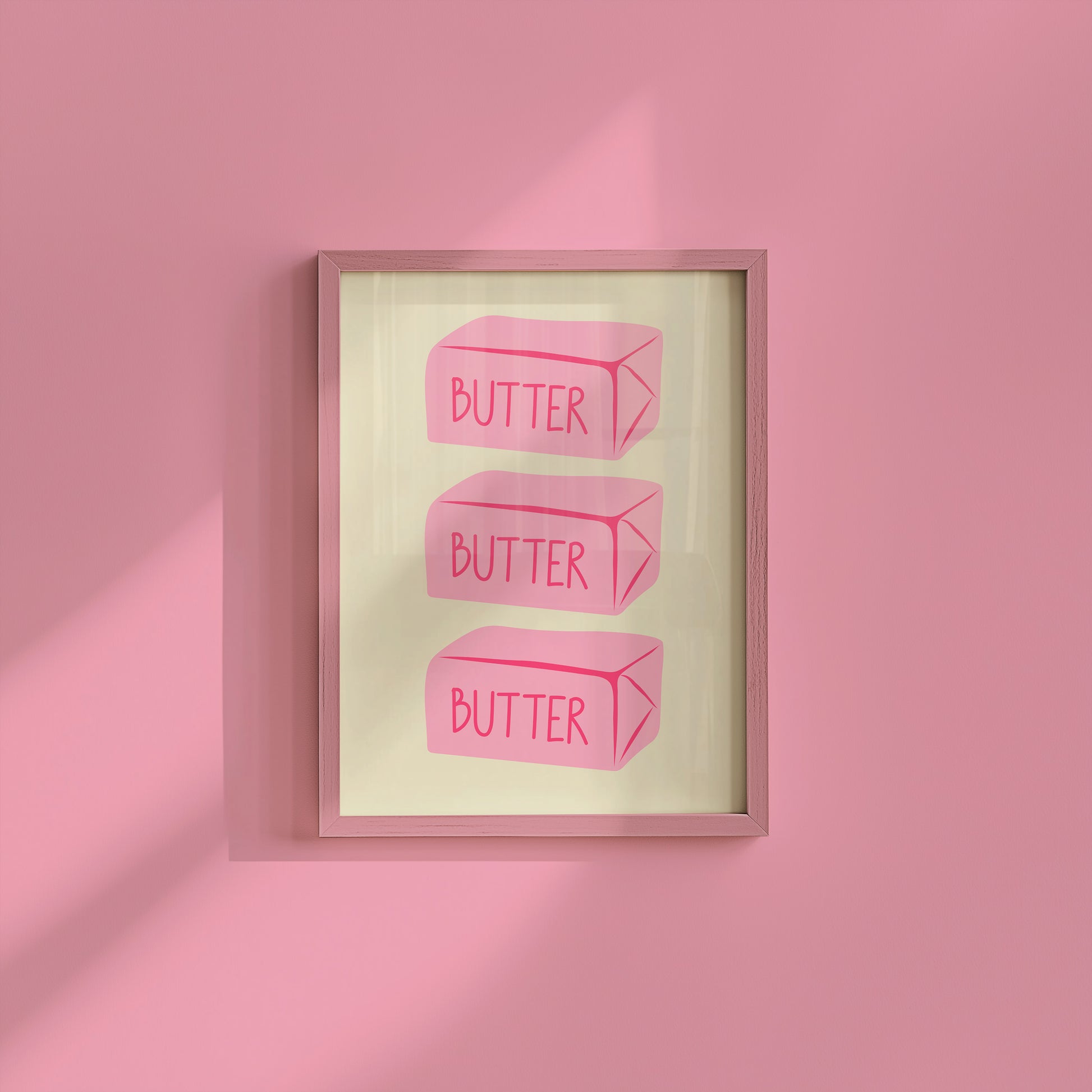 Vertical sage green wall print featuring three stacked illustrated pink butter blocks each labelled BUTTER in bold pink handwritten font