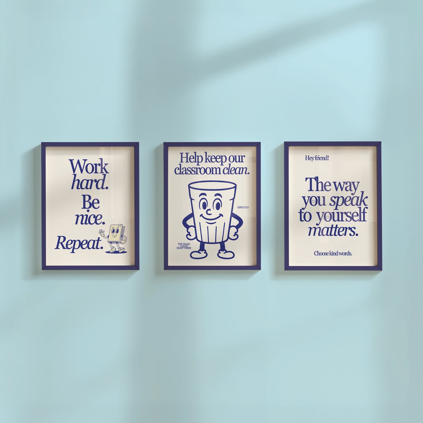 Set of 3 vertical navy and cream retro classroom prints with bold typography and character mascots including a trash can and walking book