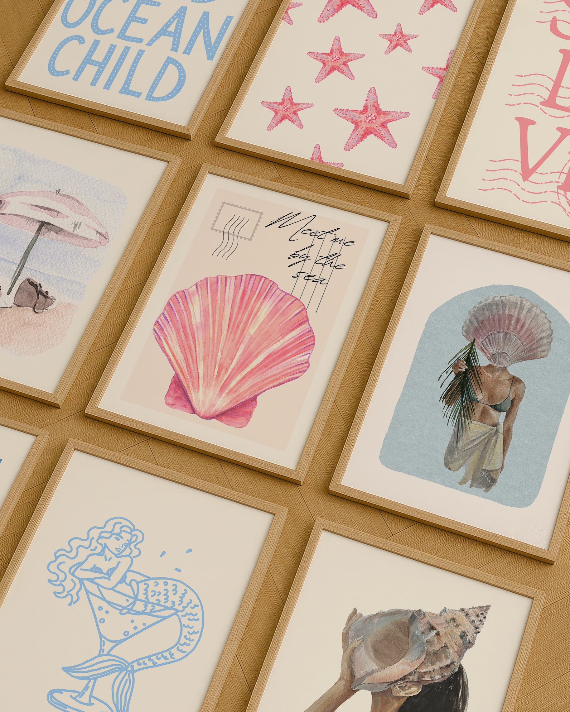 Set of 10 coastal watercolor prints in pink and blue: "Wild Like the Sea" beside a spiral shell illustration, "Stay Wild Ocean Child" in bold blue lettering, "Sea La Vie" in pink stamped typography, a mermaid lounging in a martini glass, pink starfish and seashell illustrations, a woman in a shell headdress, a beach umbrella watercolor, and "Meet me by the sea" in postcard-style script.