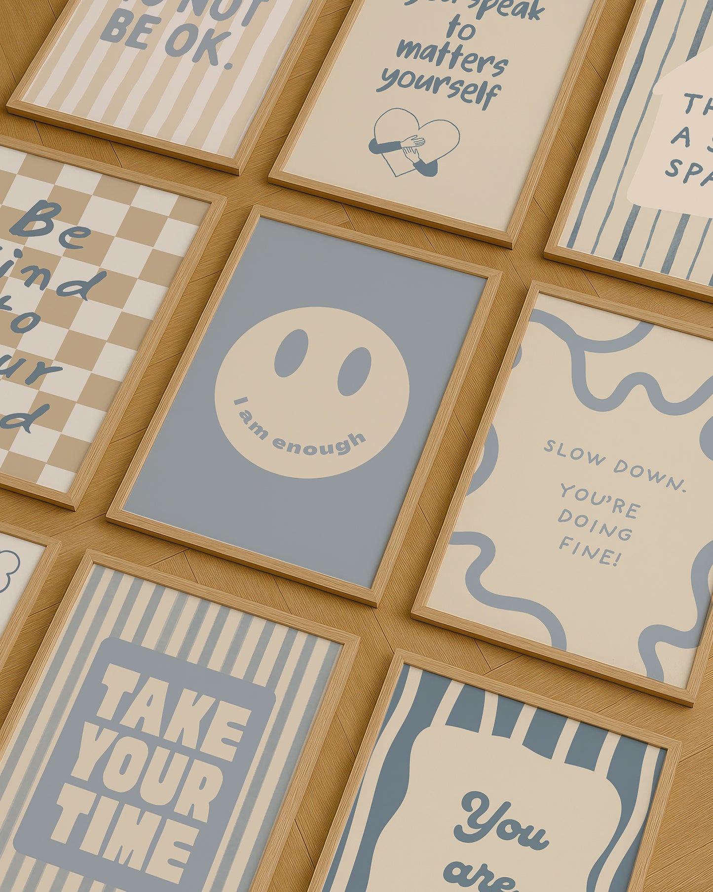 Set of 10 calm corner prints in tan and blue: "Take Your Time," "I am enough" on a smiley face, "Breathe" beside a meditating duck illustration, a "Daily Check-in, All Feelings Welcome!" chart with cartoon stars and clouds, "Slow Down, You're Doing Fine!", "You are enough," "Be Kind To Your Mind" on a checkered background, "This is a Safe Space" on a house shape, "The way you speak to yourself matters" beside a heart illustration, and "It's OK to Not Be OK."