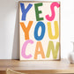 Vertical print with the words "YES YOU CAN" in large multicolored bubble letters — blue, green, pink, orange, yellow, and olive — on a white background.