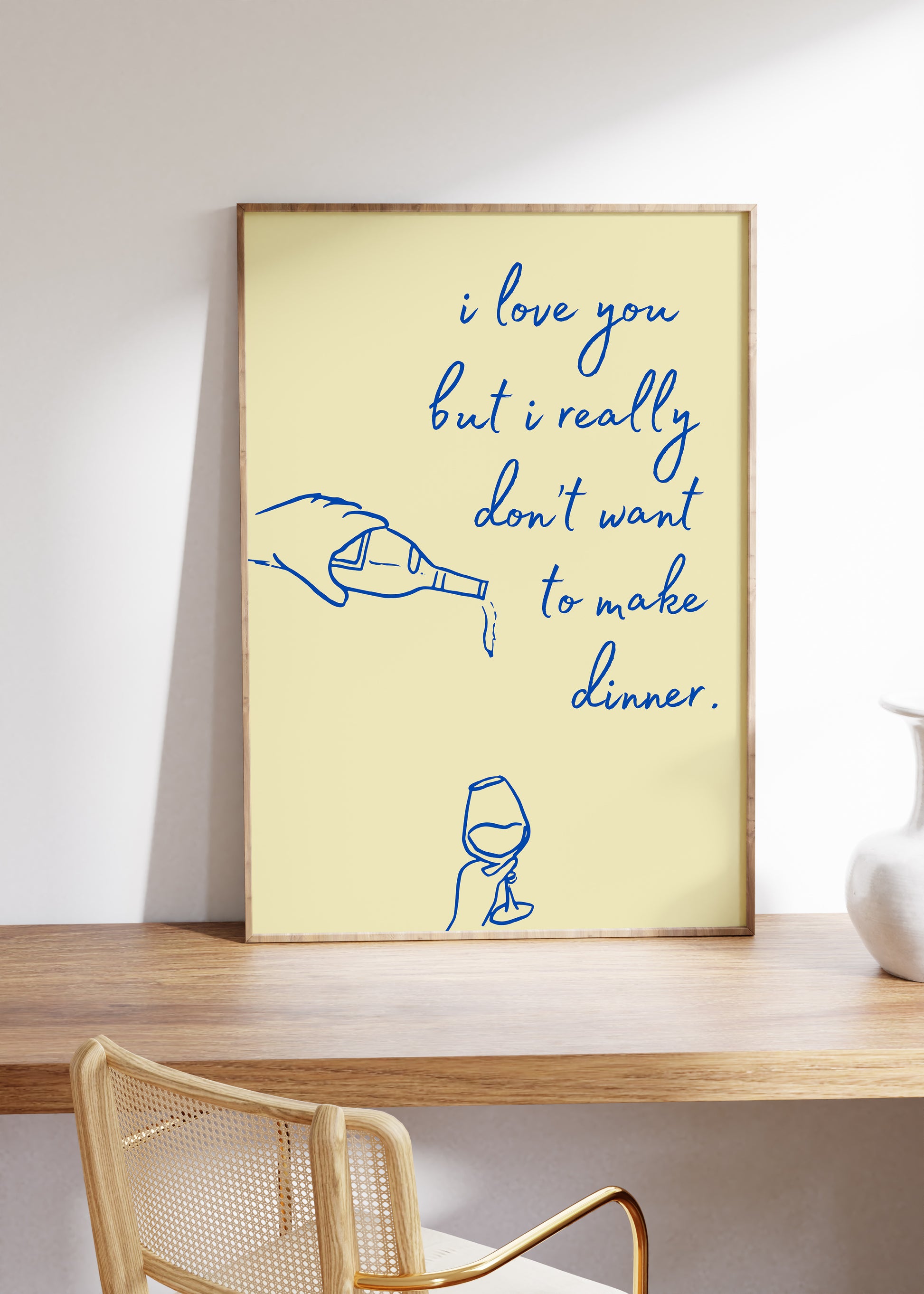 Vertical cream wall print with navy blue cursive script reading i love you but i really don't want to make dinner with hand-drawn line art of a pouring wine bottle and a wine glass