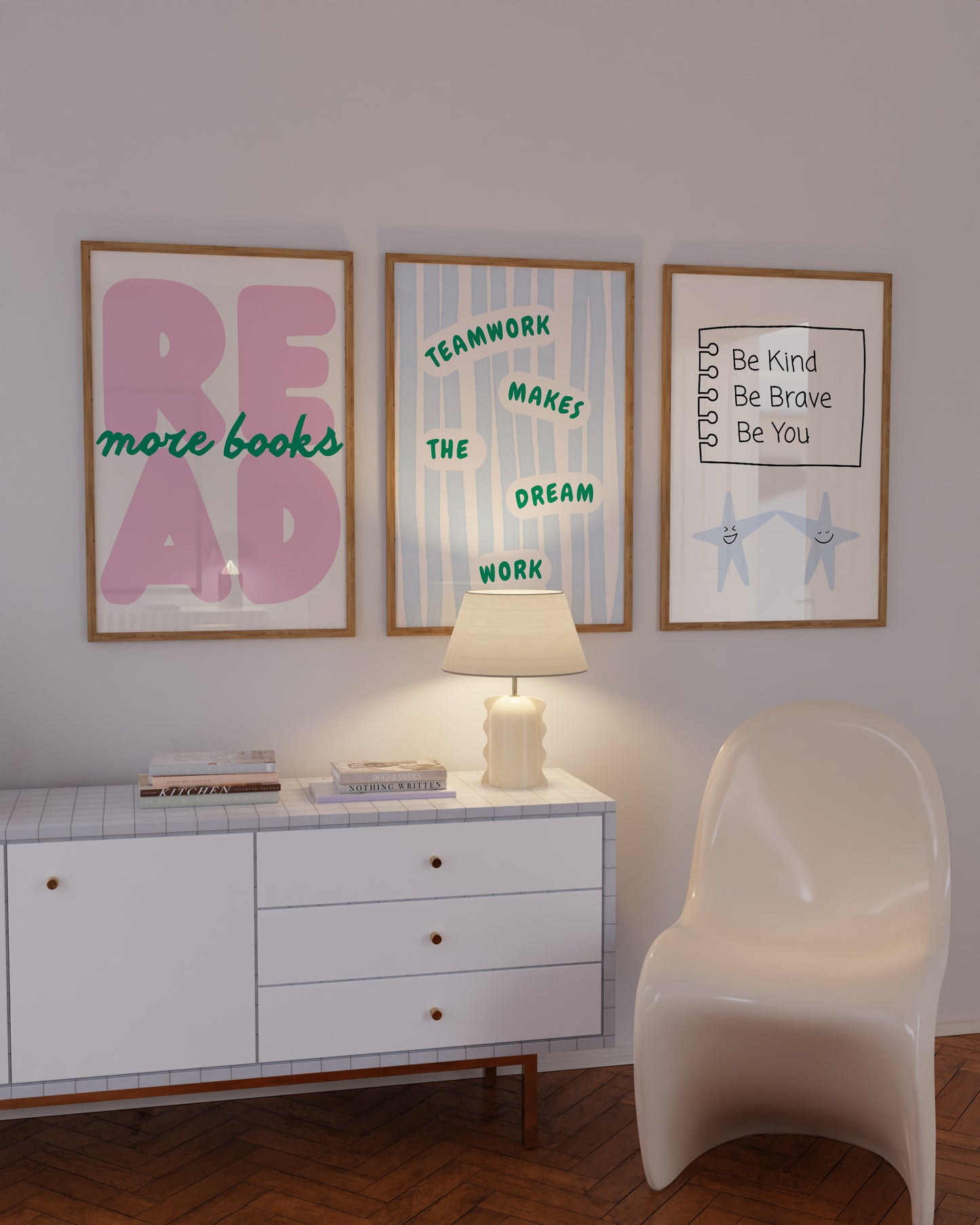 Set of 3 pastel classroom prints: "Teamwork makes the dream work" in green lettering on blue stripes, "READ more books" in pink bubble letters with green script, and "Be Kind Be Brave Be You" on a hand-drawn notebook page above two smiling star characters holding hands.