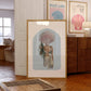 Set of 10 coastal watercolor prints in pink and blue: "Wild Like the Sea" beside a spiral shell illustration, "Stay Wild Ocean Child" in bold blue lettering, "Sea La Vie" in pink stamped typography, a mermaid lounging in a martini glass, pink starfish and seashell illustrations, a woman in a shell headdress, a beach umbrella watercolor, and "Meet me by the sea" in postcard-style script.