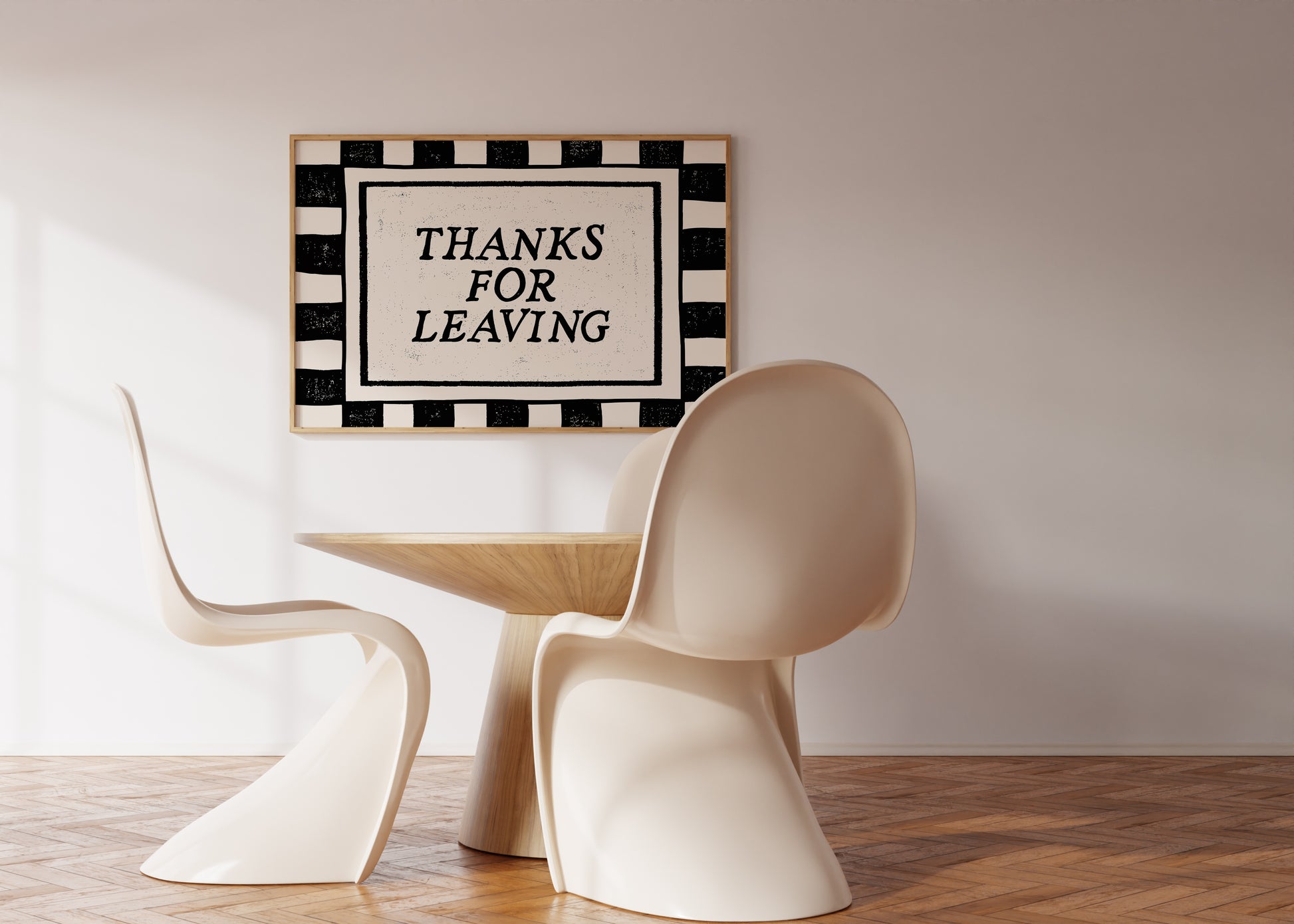 Horizontal wall print with bold black and cream vertical stripes forming a border around a cream text box with distressed black serif typography reading THANKS FOR LEAVING