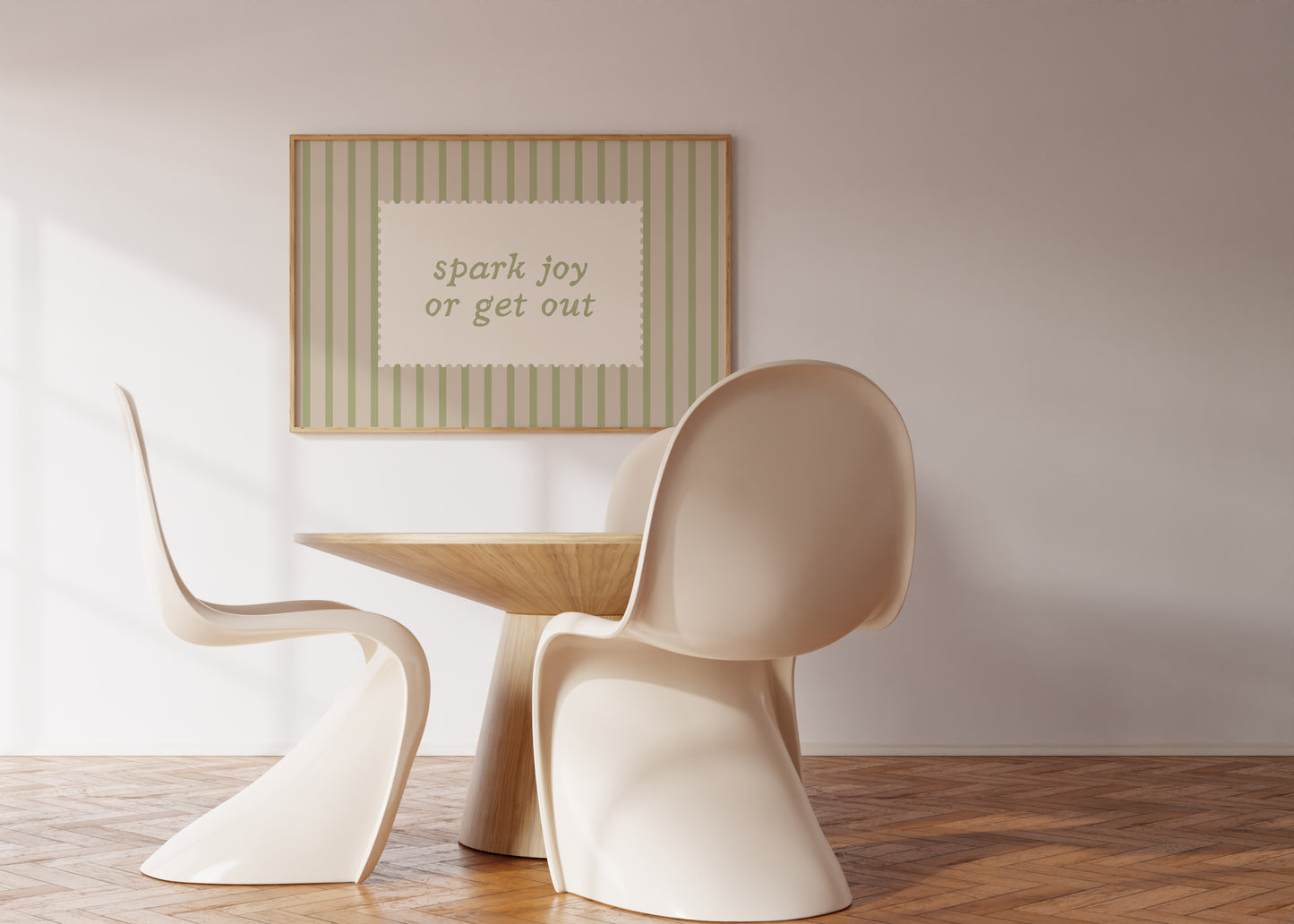 Horizontal wall print with soft sage green vertical stripes and a cream scalloped border text box reading spark joy or get out in matching sage green cursive font