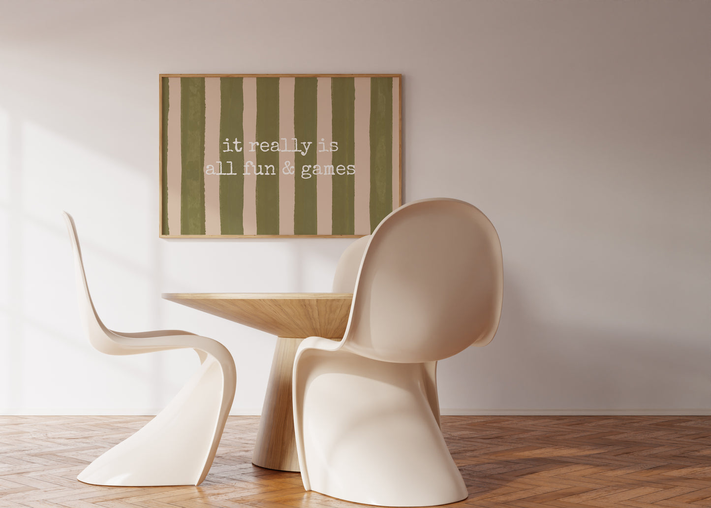 Horizontal print with olive green and cream hand-painted vertical stripes and the quote "it really is all fun & games" in white typewriter-style lettering across the center.