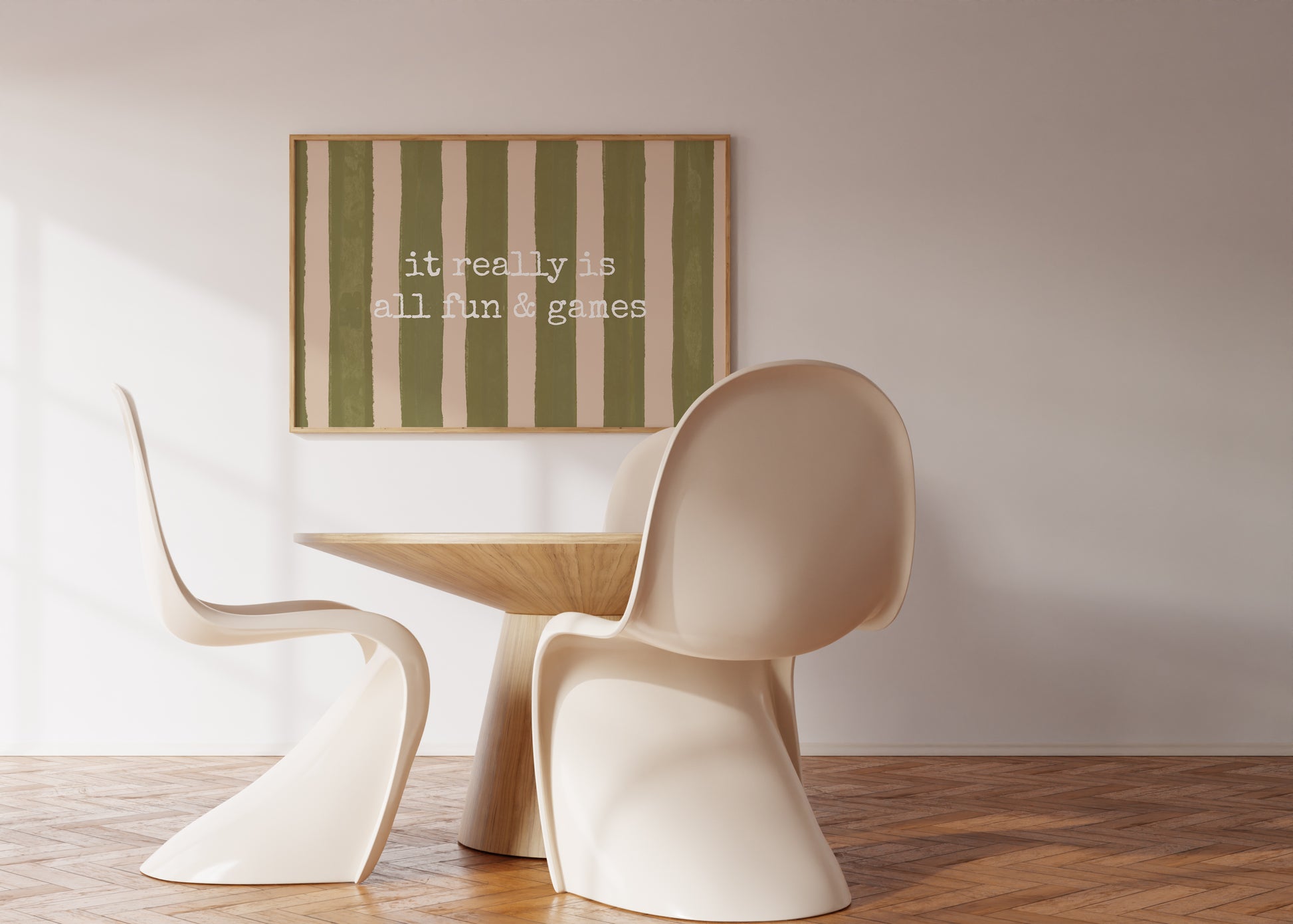 Horizontal print with olive green and cream hand-painted vertical stripes and the quote "it really is all fun & games" in white typewriter-style lettering across the center.