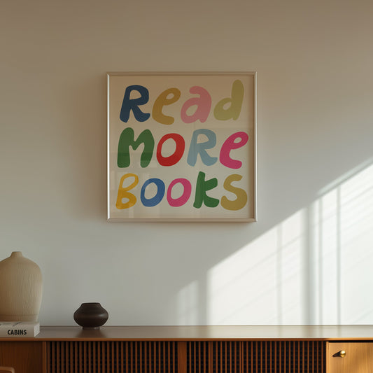Square print with the words "Read More Books" in large multicolored bubble letters — blue, yellow, pink, green, red, and orange — stacked on three lines against a cream background.