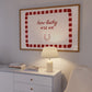 White print with a red and pink striped border featuring the handwritten quote 'how lucky are we' and a horseshoe illustration