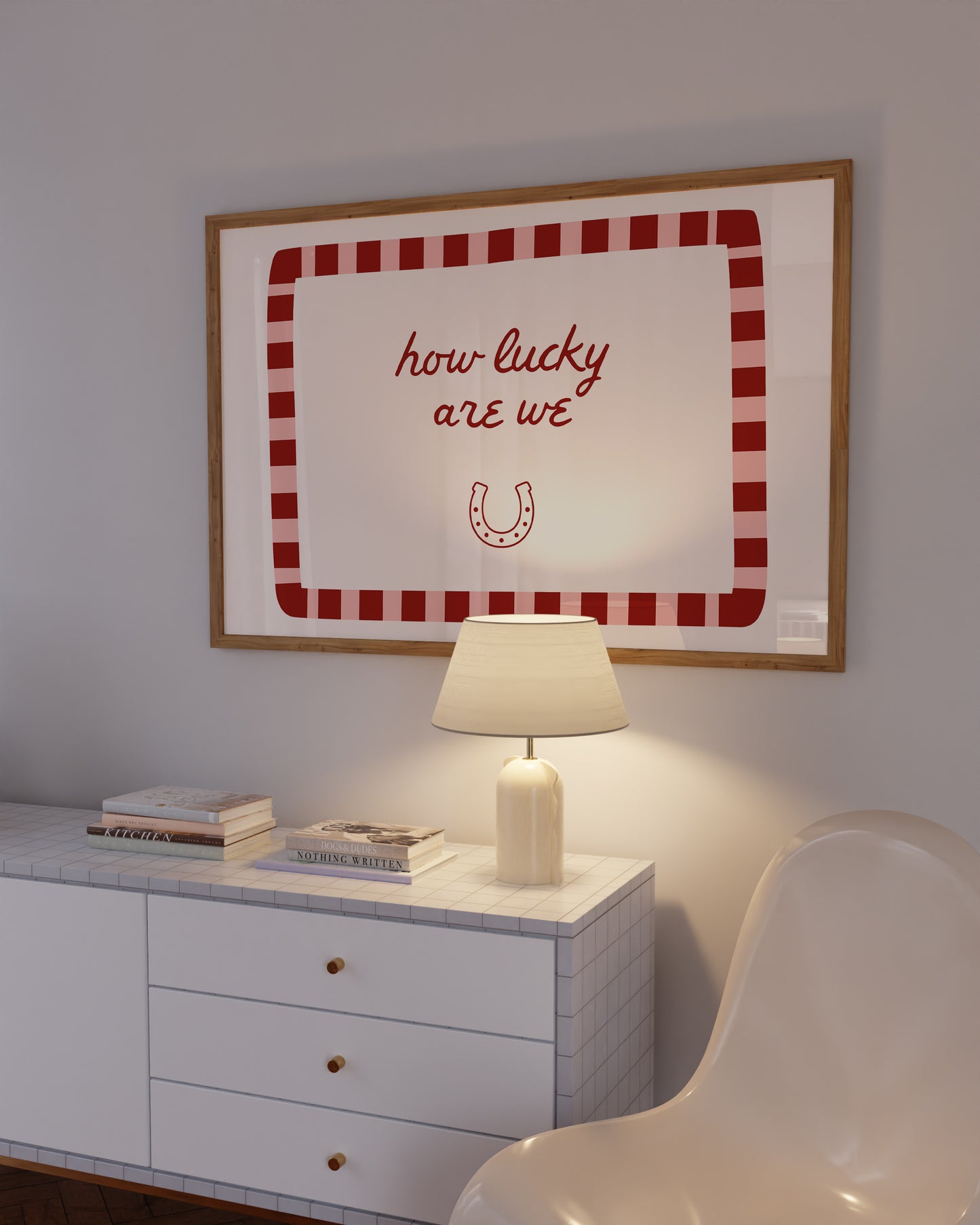 White print with a red and pink striped border featuring the handwritten quote 'how lucky are we' and a horseshoe illustration