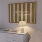 Horizontal print with olive green and cream hand-painted vertical stripes and the quote "it really is all fun & games" in white typewriter-style lettering across the center.