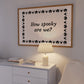 Landscape digital print with a cream background bordered by alternating black pumpkin and spider illustrations, framing the hand-lettered phrase "How spooky are we?" in black script.