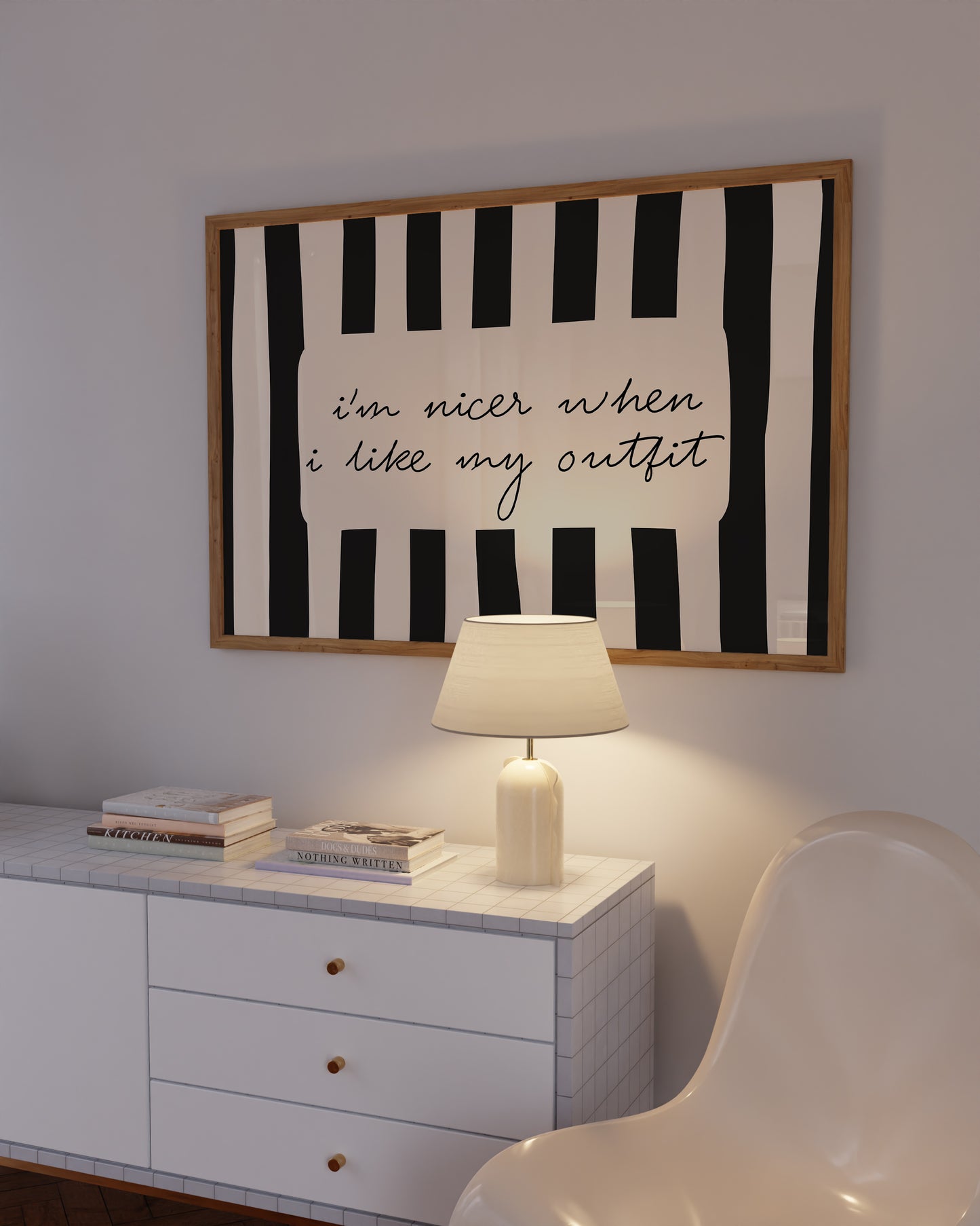Horizontal print with bold black and white vertical stripes framing the handwritten cursive quote "i'm nicer when I like my outfit" in a rounded cream panel.