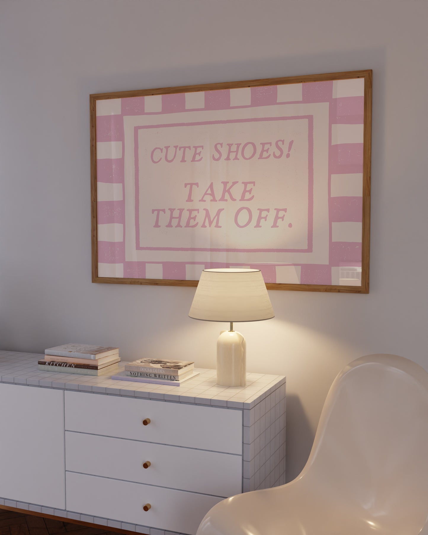 Horizontal wall print with pink and cream checkered border and a cream centre text box in bold serif typography reading Cute Shoes! Take Them Off. in dusty pink