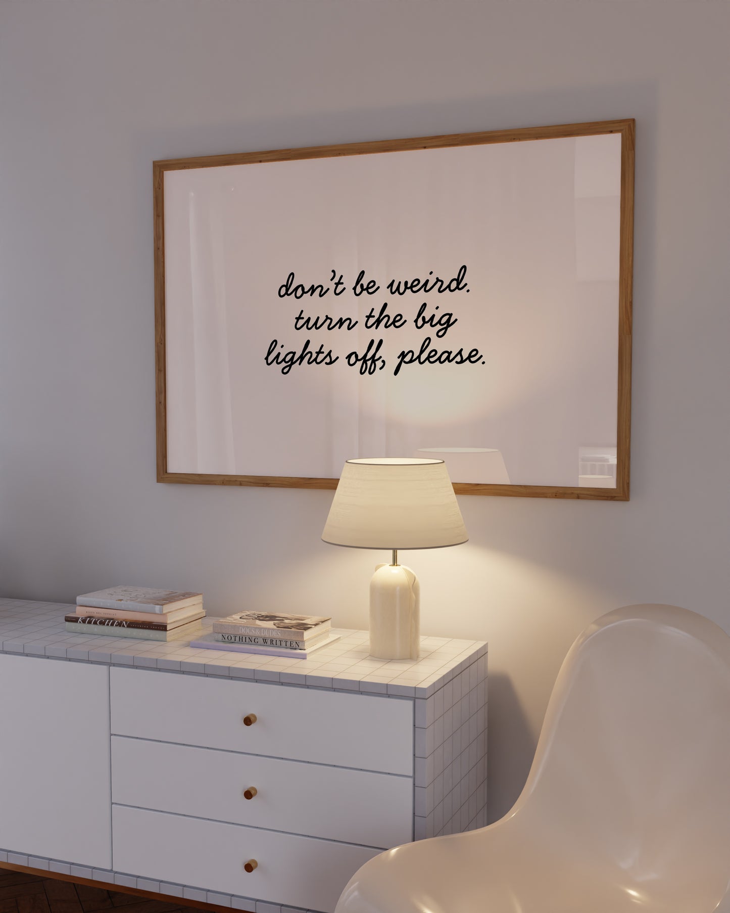 Horizontal white wall print with elegant black cursive script reading don't be weird. turn the big lights off, please.