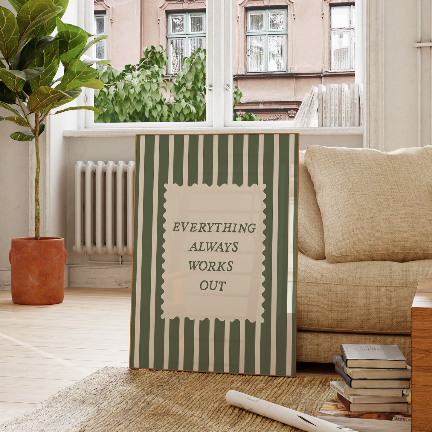 Vertical wall print with bold forest green vertical stripes and a cream scalloped text box reading Everything Always Works Out in dark green serif typography