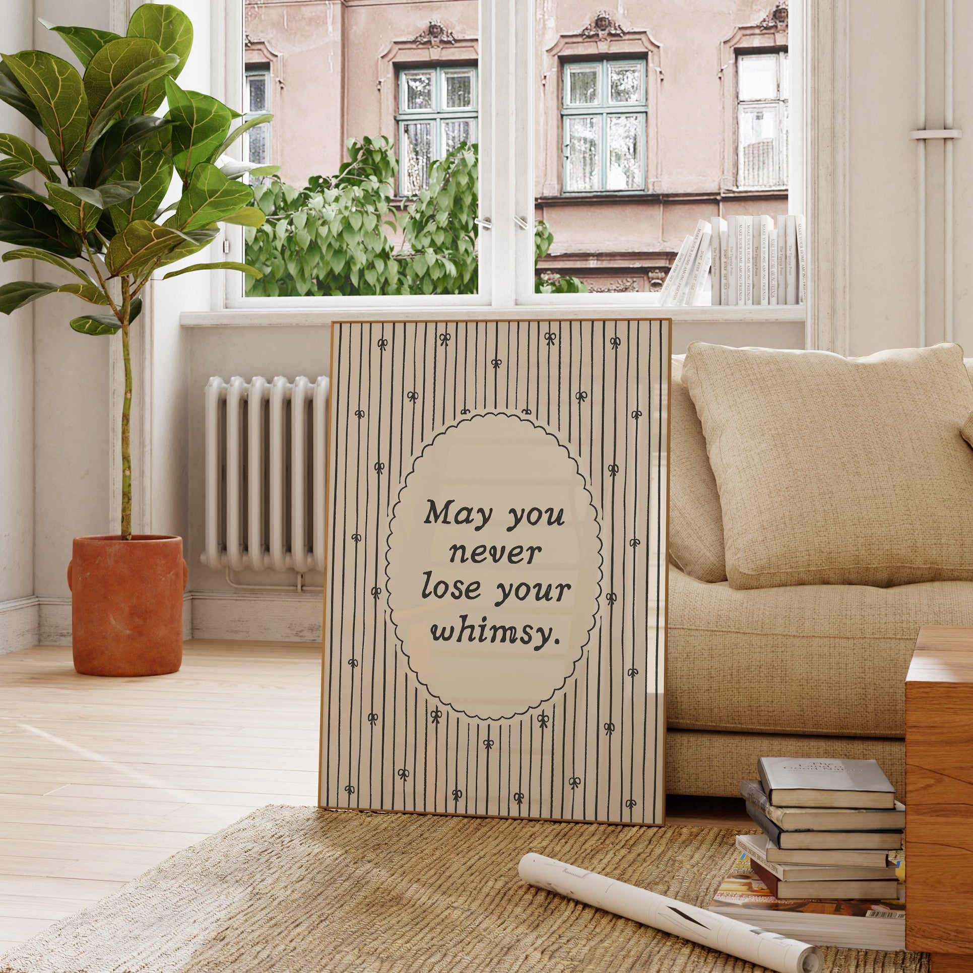Vertical print with the quote "May you never lose your whimsy." in italic serif type inside a scalloped oval frame, surrounded by thin navy pinstripes decorated with small hand-drawn bows on a cream background.