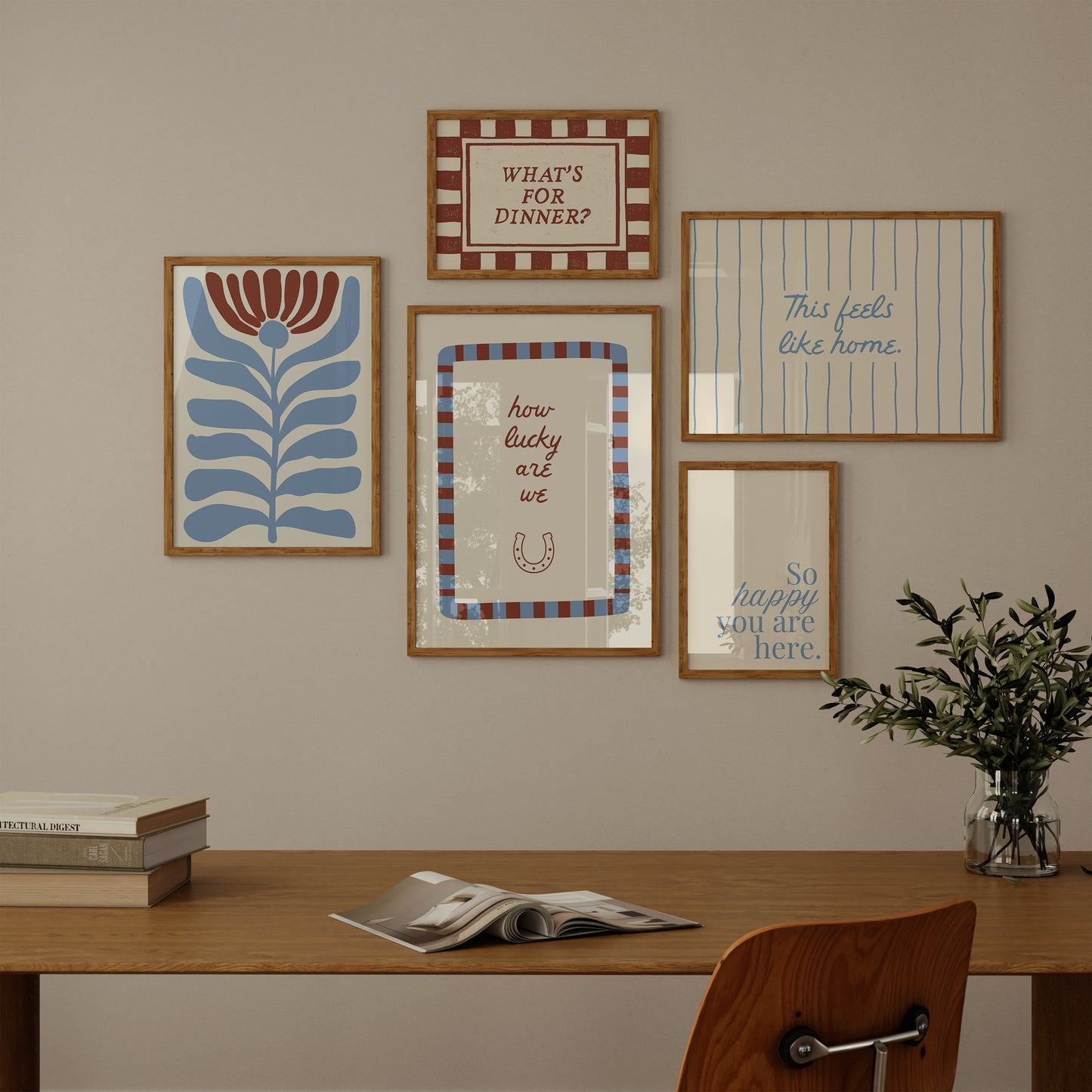 Set of five prints in rust and dusty blue: "How lucky are we" with a horseshoe, "So happy you are here," "What's for dinner?" in a checkered border, "This feels like home" on stripes, and a floral illustration