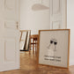 Square print with a hand-drawn illustration of two wine glasses clinking together, and the quote "everything's fine when there's wine" in bold black lettering below.