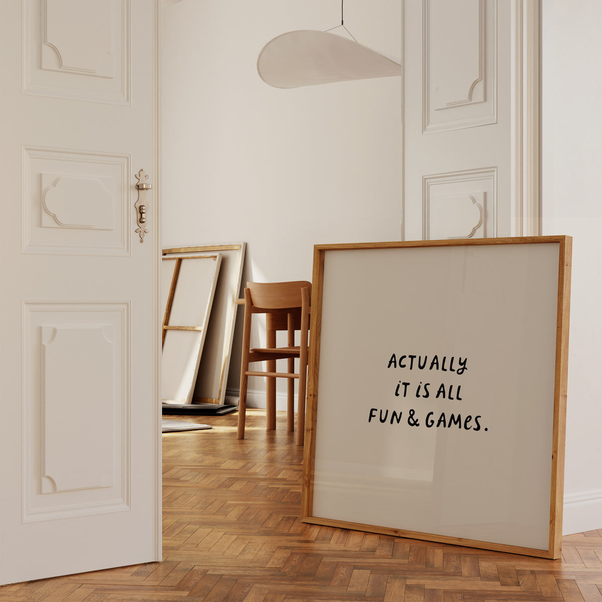Square print with a cream background and the quote "Actually it is all fun & games." in bold black hand-lettered type.