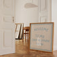 Beige print with dusty blue hand-lettered text "Welcome to my one woman show." inside a double-line border