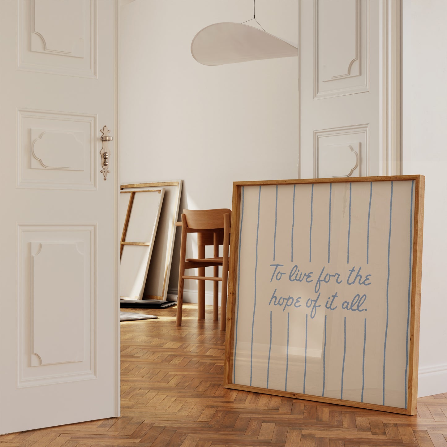 Cream print with thin vertical blue stripes and a hand-lettered quote in blue cursive script