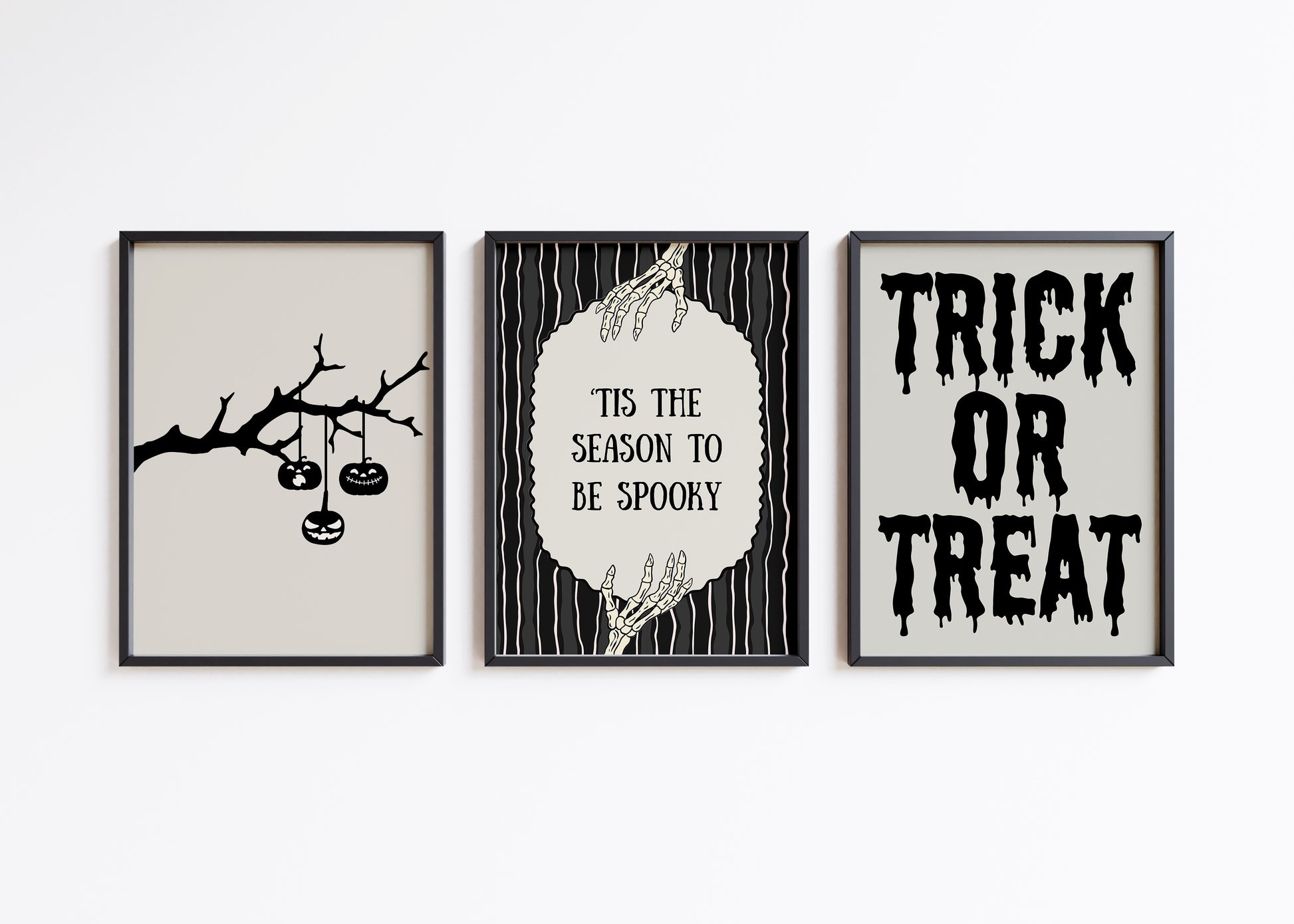 Set of 3 black and white Halloween prints: dripping "Trick or Treat" typography, "'Tis the season to be spooky" framed by skeleton hands, and a black silhouette branch with hanging jack-o'-lanterns.