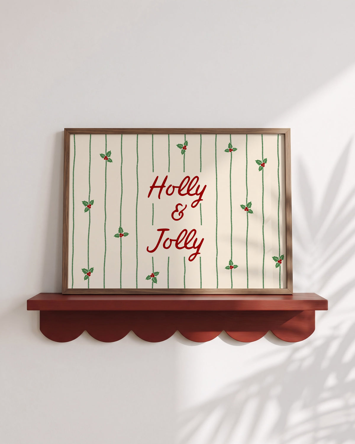 Christmas print with "Holly & Jolly" script text, holly leaves, and red berries on cream striped background