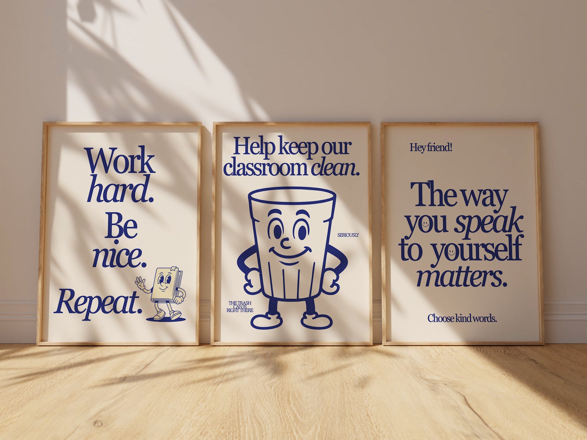 Set of 3 vertical navy and cream retro classroom prints with bold typography and character mascots including a trash can and walking book