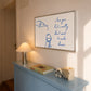 Print with hand-drawn blue line art of a bottle pouring wine into a glass beside the cursive quote "i love you but i really don't want to make dinner."