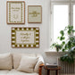 Set of five olive and cream prints including a checkered 'Actually it is all fun & games' print, a horseshoe 'How lucky are we' print, 'The Homebody Club', a striped 'good old days' print, and bubble-letter 'Home sweet'