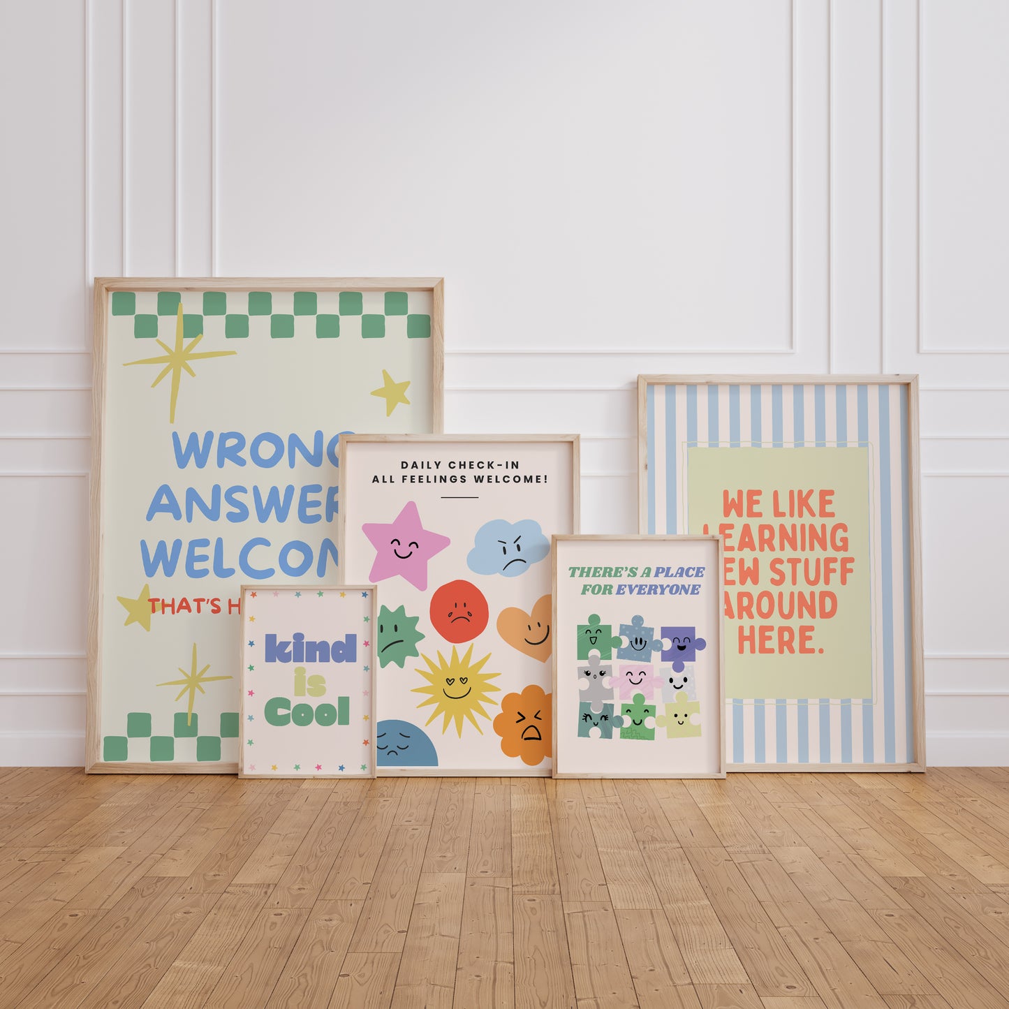 Set of 10 pastel classroom prints in a retro style, including blue pennant flags reading kind, brave, curious, a daily feelings check-in chart with smiling star, cloud, and sun characters, a puzzle piece print reading "There's a place for everyone," and colourful typography posters with quotes like "Wrong answers welcome," "Yes you can," and "It's a good day to try again."