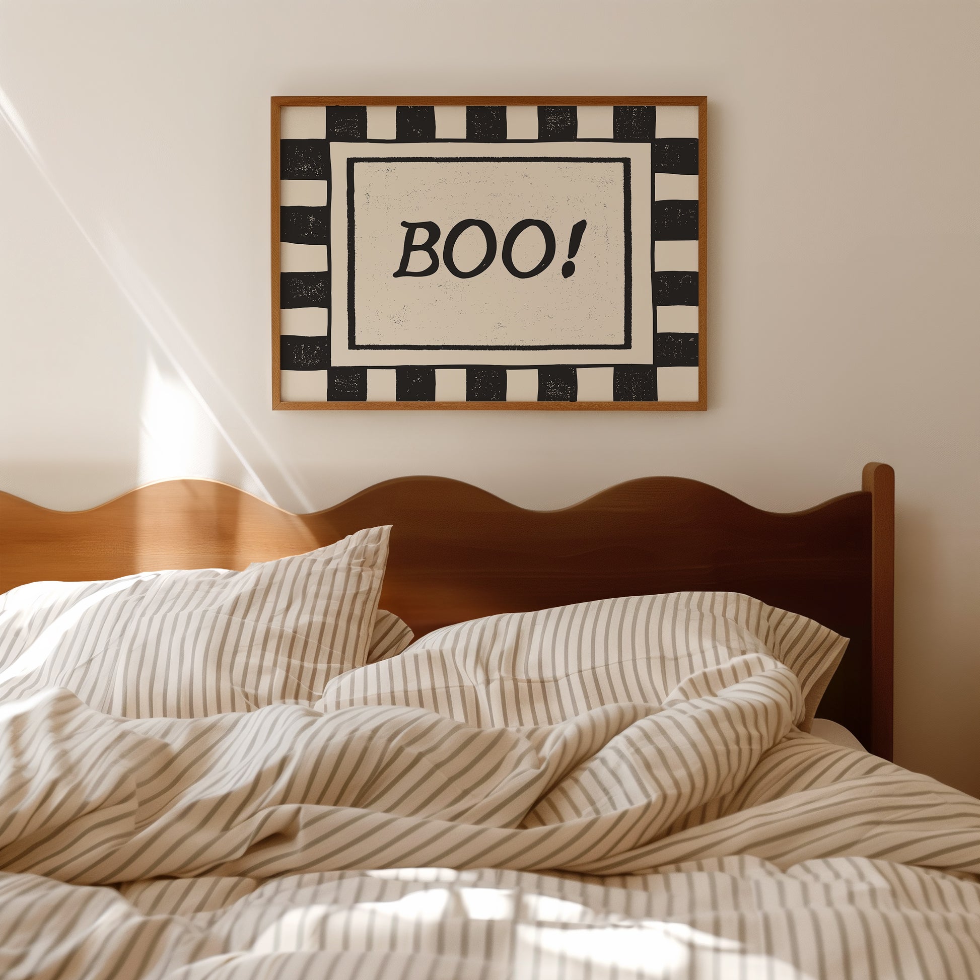Horizontal print with a bold black and white checkered border framing the word "BOO!" in black hand-drawn type on a textured cream background.