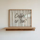 Horizontal print with hand-painted taupe and cream vertical stripes and the question "Coffee or tea?" in brown brush-lettered script across the center.