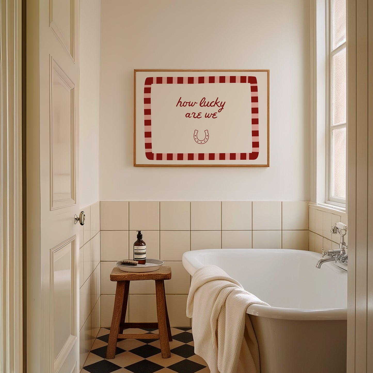 White print with a red and pink striped border featuring the handwritten quote 'how lucky are we' and a horseshoe illustration