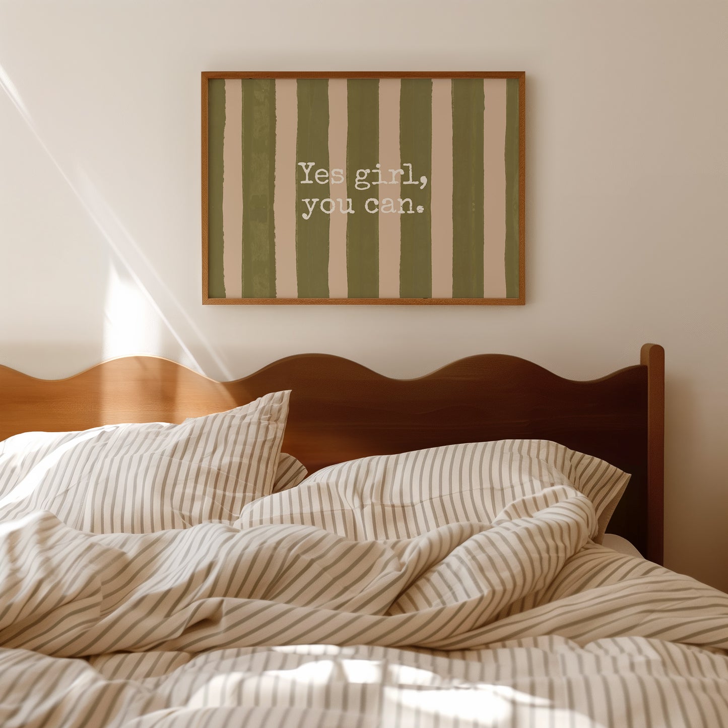Horizontal wall print with bold olive green brush stroke vertical stripes on a warm cream background with white typewriter font text reading Yes girl, you can.