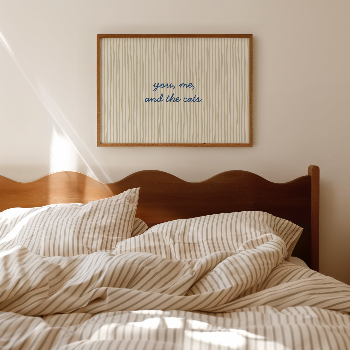 Horizontal wall print with soft sage green wavy vertical stripes and delicate navy blue cursive script reading you me and the cats