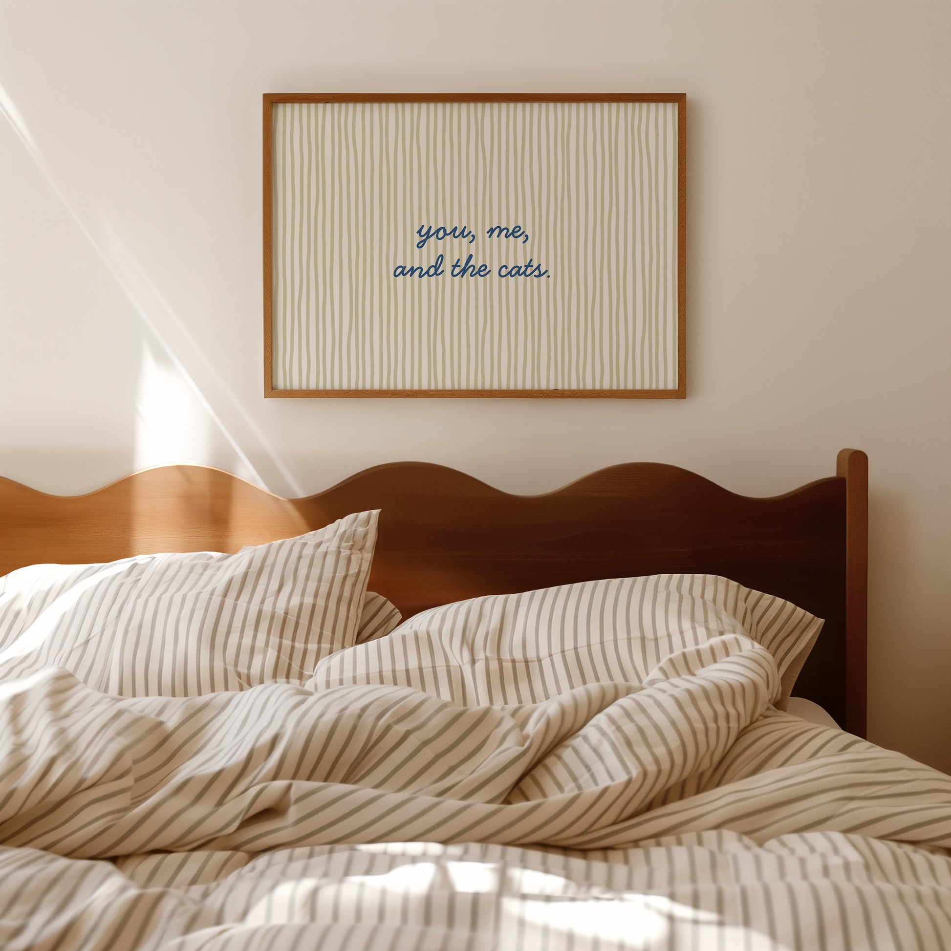 Horizontal wall print with soft sage green wavy vertical stripes and delicate navy blue cursive script reading you me and the cats
