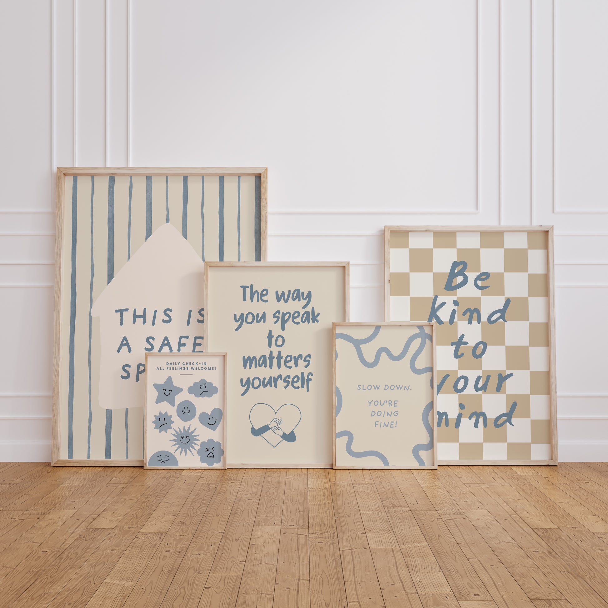 Set of 10 calm corner prints in tan and blue: "Take Your Time," "I am enough" on a smiley face, "Breathe" beside a meditating duck illustration, a "Daily Check-in, All Feelings Welcome!" chart with cartoon stars and clouds, "Slow Down, You're Doing Fine!", "You are enough," "Be Kind To Your Mind" on a checkered background, "This is a Safe Space" on a house shape, "The way you speak to yourself matters" beside a heart illustration, and "It's OK to Not Be OK."