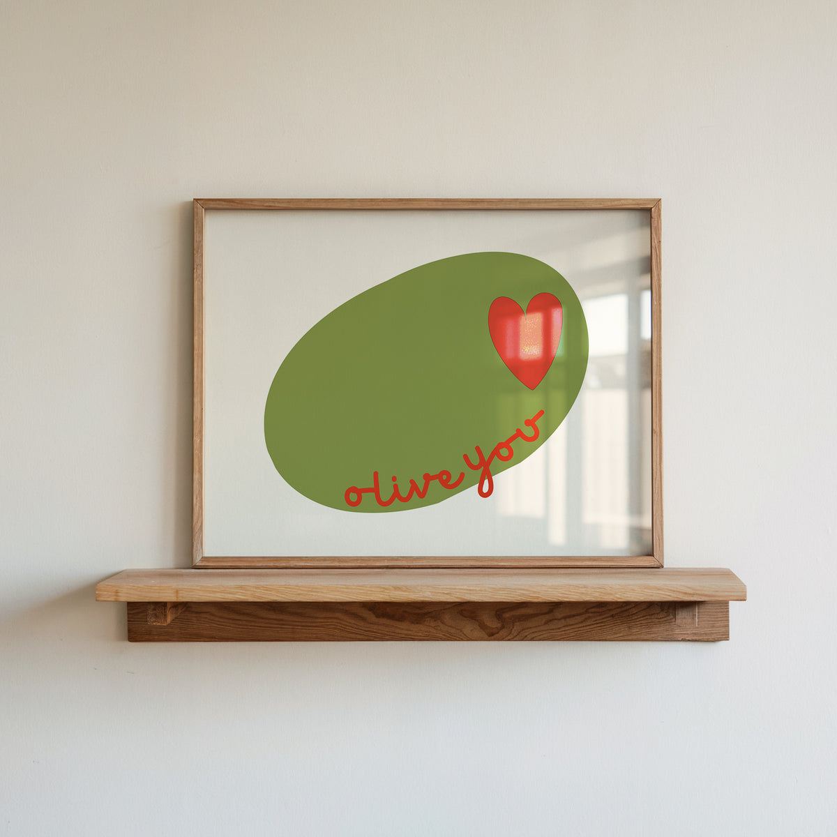 Horizontal print of a large green olive illustration with a small red heart and the words "olive you" in red cursive script, on a cream background.