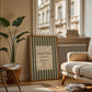 Vertical wall print with bold forest green vertical stripes and a cream scalloped text box reading Everything Always Works Out in dark green serif typography